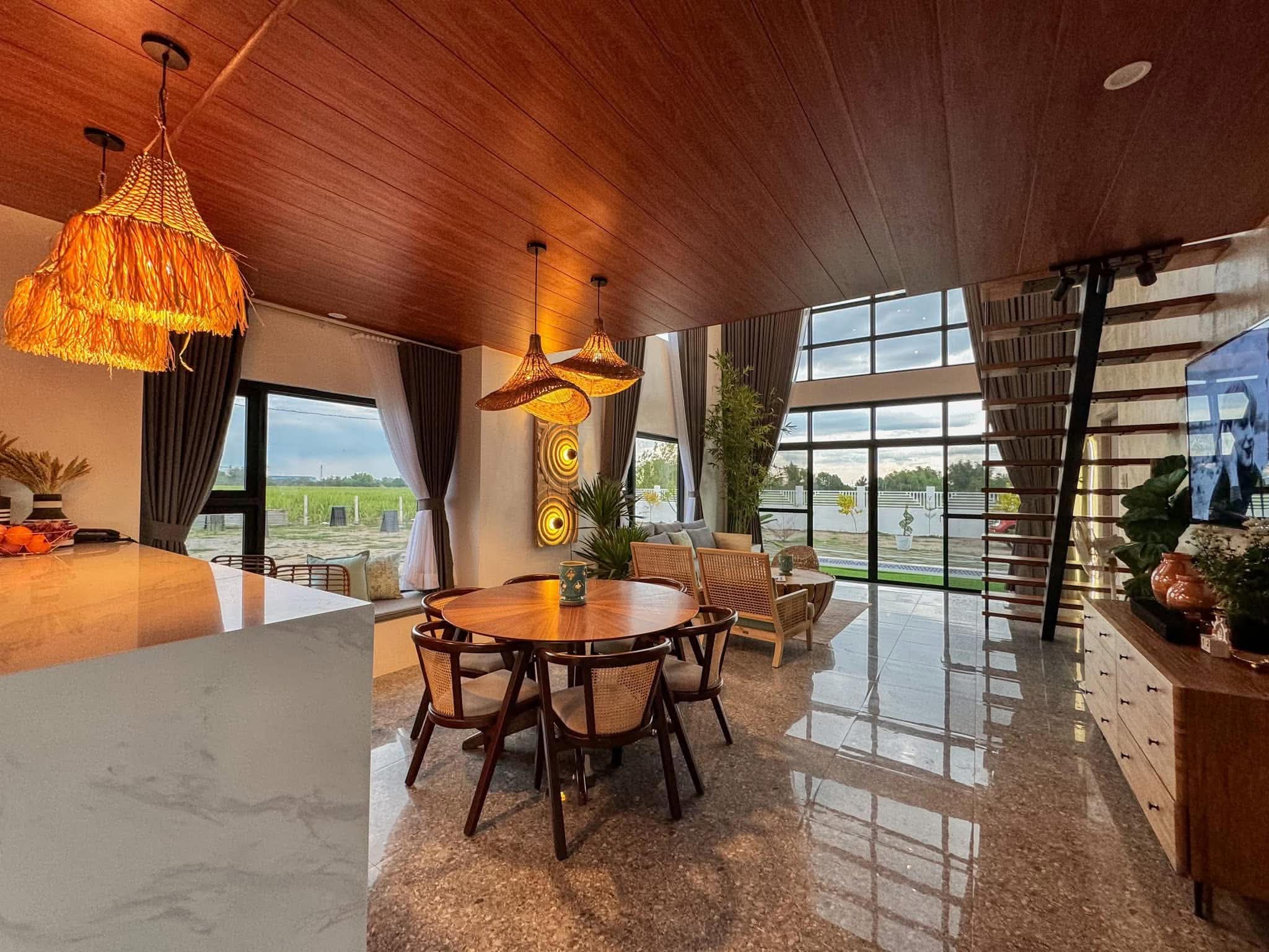 Original Casa Bermuda open-plan interior with wood ceiling and dining area